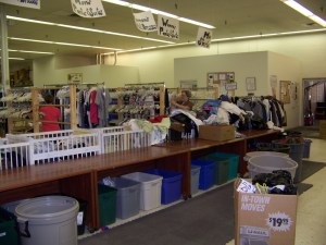 Drop-side cribs find a second life as sorting bins at NAM thrift store