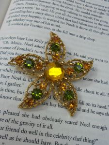 Consignment jewelry photographed on a book.