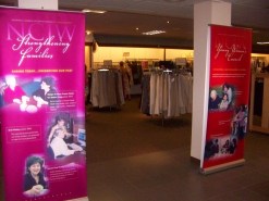 Banners tell the story about the services this NFP thrift store helps fund