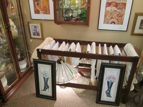 Who says a lamp can't sit on the floor, making these vintage linens look wonderful? KInda like a window display without needing a window, isn't it?