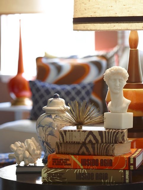 Use unsold or for-sale books in your consignment shop as props and risers